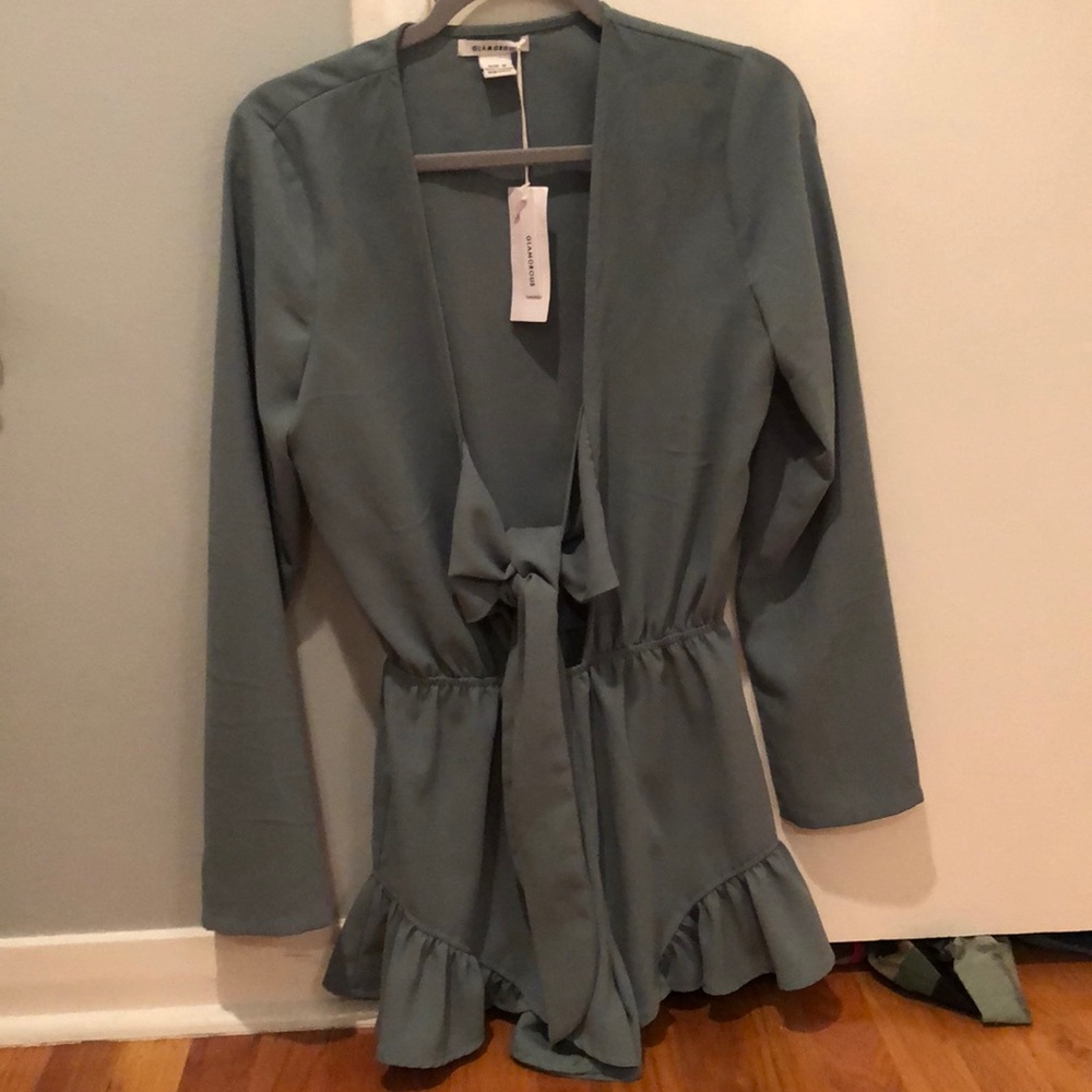 Never worn romper with tags on from LF!